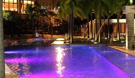 swimming pool led lighting design with purple LED pool lights by LAND ART Landscape Architecture